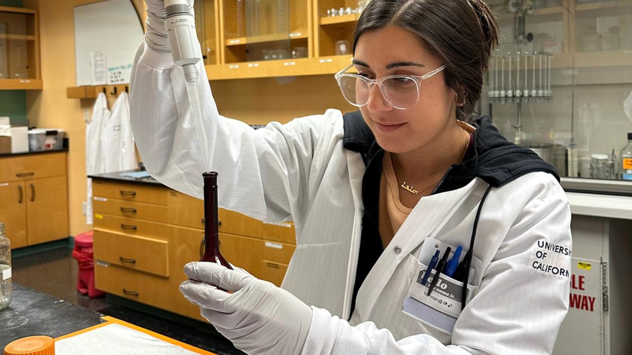 UC Davis Forensic Science master's grad Hannah David pipetting in the lab