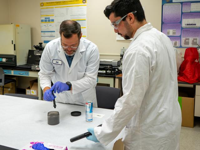 UC Davis Forensic Science lecturer Philip Hess demonstrates how to dust for fingerprints