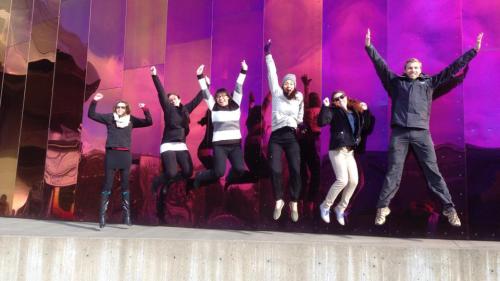 UC Davis Forensic Science graduate Shane Williams and fellow alumni jumping and posing mid air in Seattle