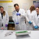 UC Davis Forensic Science lecturer Philip Hess and students look at footwear tracks