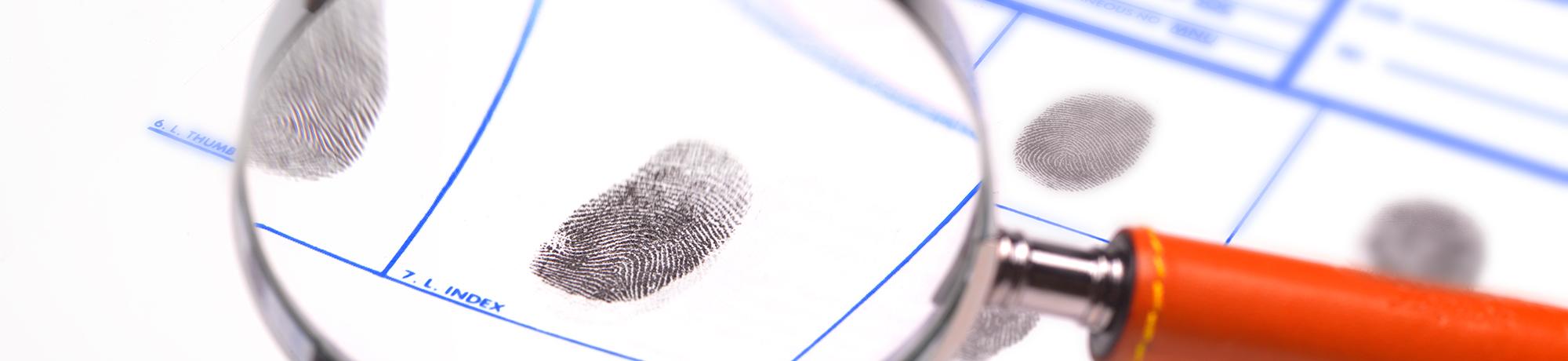 magnifying glass on a fingerprint card